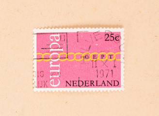 Fototapeta na wymiar THE NETHERLANDS 1971: A stamp printed in the Netherlands shows the Netherlands and it's place in Europe, circa 1971