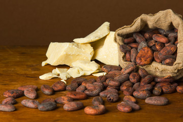 Cacao beans on wooden bacground.