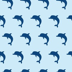 Vector seamless pattern with cute jumping dolphins on blue background