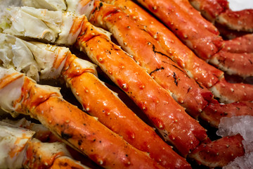 Several units of king crab legs over ice
