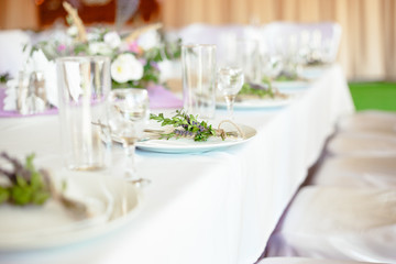 Light white lavander flower served wedding table plate fork knife 