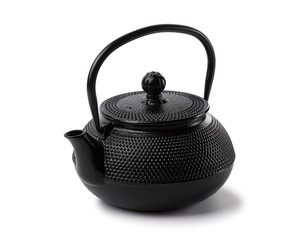 Black cast iron teapot. Isolated on white background.