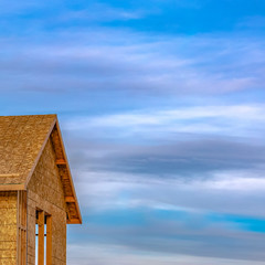 Square frame Close up of the exterior of an unfinished house at a construction site