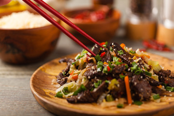Traditional Korean Bulgogi dish.  Thinly cut, grilled beef, served with rice and vegetables.