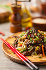 Traditional Korean Bulgogi dish.  Thinly cut, grilled beef, served with rice and vegetables.