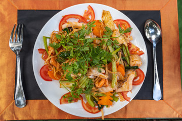 Top view of Thai style stir-fried seafood noodle mixed vegetable