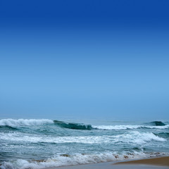 Seascape image of beautiful close up waves in moody rainy morning