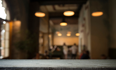 blurred background of bar and dark brown desk space of retro wood