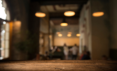 blurred background of bar and dark brown desk space of retro wood