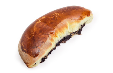 Whole poppy seed pie on a white background