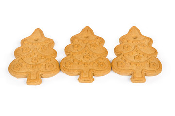 Cookies in form of Christmas trees on a white background
