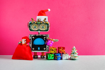 Celebration Christmas party New Year Santa Claus robotic greeting card. Happy robot in Santa hat,...