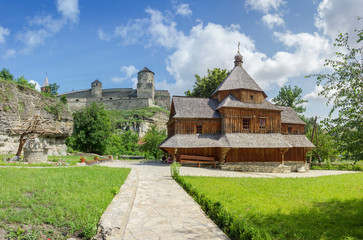 Fototapeta na wymiar Cross Exaltation Church against of mediaeval fortress, Kamianets-Podilskyi, Ukraine