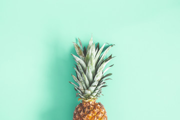 Pineapple on mint background. Summer concept. Flat lay, top view