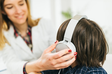 Hearing Test for Children - Audiologist Working with a Little Boy