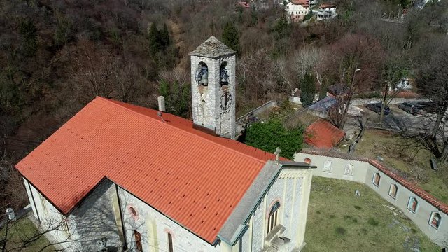 Aerial view of Sant Ambrogio Church situated in painted village Arcumeggia in province of Varese, Italy