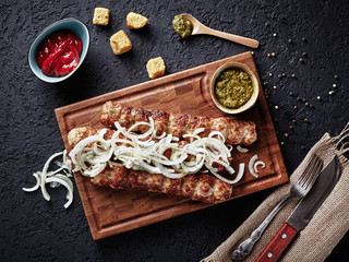 Top view of an appetizing kebab on a wooden board