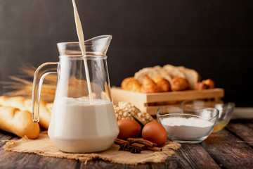 Pour the milk in a jug placed on the sack