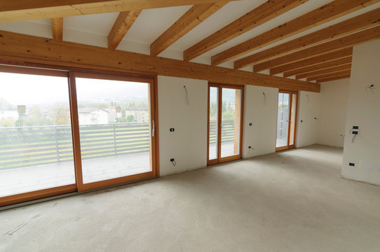 Home renovation: large open space with exposed wooden beams