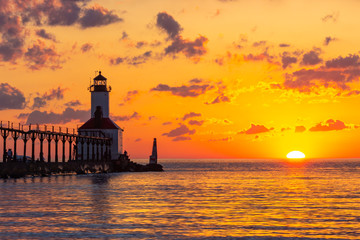 Dramatic Sunset at Michigan City East Pierhead Lighthouse - obrazy, fototapety, plakaty