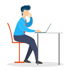 Man in a suit sitting at the desk and working