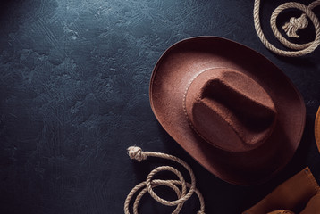 cowboy hat at table wooden background
