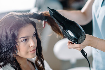 Drying hair in hair salon - obrazy, fototapety, plakaty