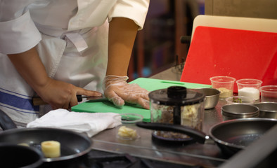 Obraz na płótnie Canvas Chef press and chop garlic on board. Homemade cooking food