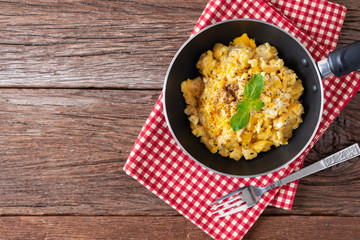 Scrambled egg on pan. Top view with Copy space.