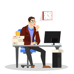 Man in a suit sitting at the desk and working