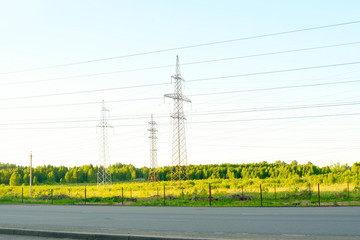 high voltage post at the track. high voltage tower sky background.
