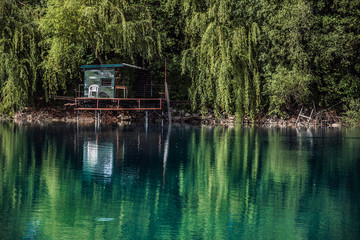 Fototapeta na wymiar Small fishing hut near Kosariska lake