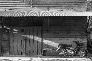 Black and white picture of ancient house in country side, Thailand