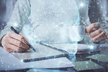 Double exposure of writing hand on background with brain hologram. Concept of learning.