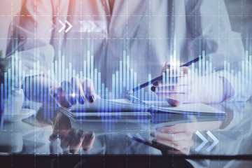 Financial chart drawn over hands taking notes background. Concept of research. Multi exposure
