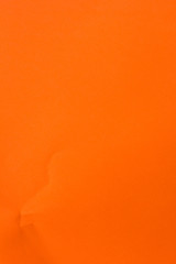 Orange textured paper background , close up