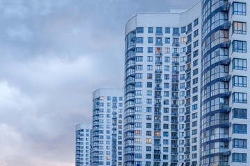 Fototapeta premium Urban abstract background, detail of modern glass facade, office business building. New apartments. Residential building. Modern apartment condominium building. Copy space