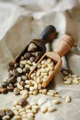 Cedar nuts on wooden spoons.