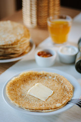Russian pancakes with the butter on a restaurant.