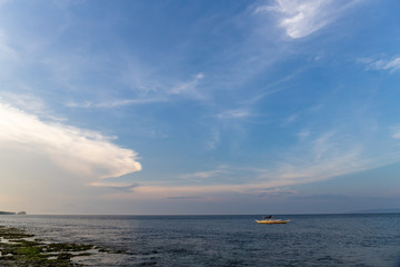 boat in sea at sunset, Capul islands, Philippines