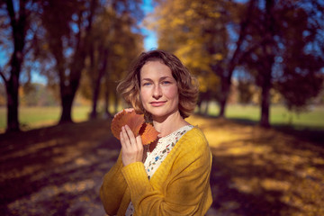 Lovely woman in autumn park
