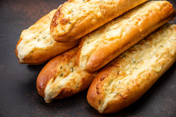 Assortment of fresh French baguettes on a wooden table