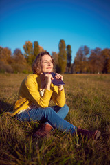 Woman with a notebook in the park