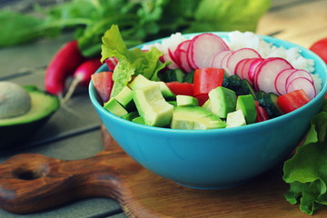 Balanced healthy diet salad. Fresh vegetables, wild rice, fresh yogurt . Avocado, radish, cucumber, tomato