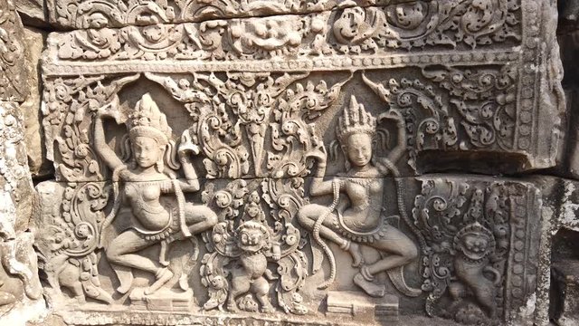 The image of the divine dancers of Apsara in the ancient temple of Bayon, Angkor Wat, Cambodia.