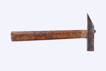 Old hammer isolated on a white background. Rusty metal hammer with wooden handle, horizontal image.