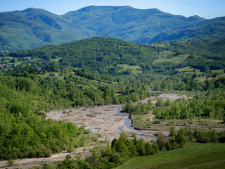 Fototapeta na wymiar Landscape in Emilia Romagna with Ingegna River, a tributory of the Taro. Italy.