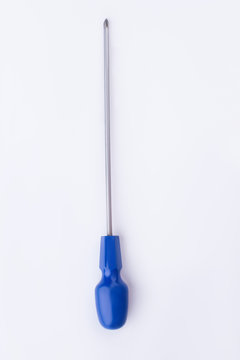 Long screwdriver with blue handle on white background. Hand tool for repair, vertical image.