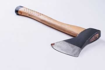 Old axe isolated on white background. Used axe with wooden handle, horizontal image.