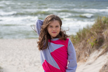 portrait of a little beautiful girl on the Baltic sea